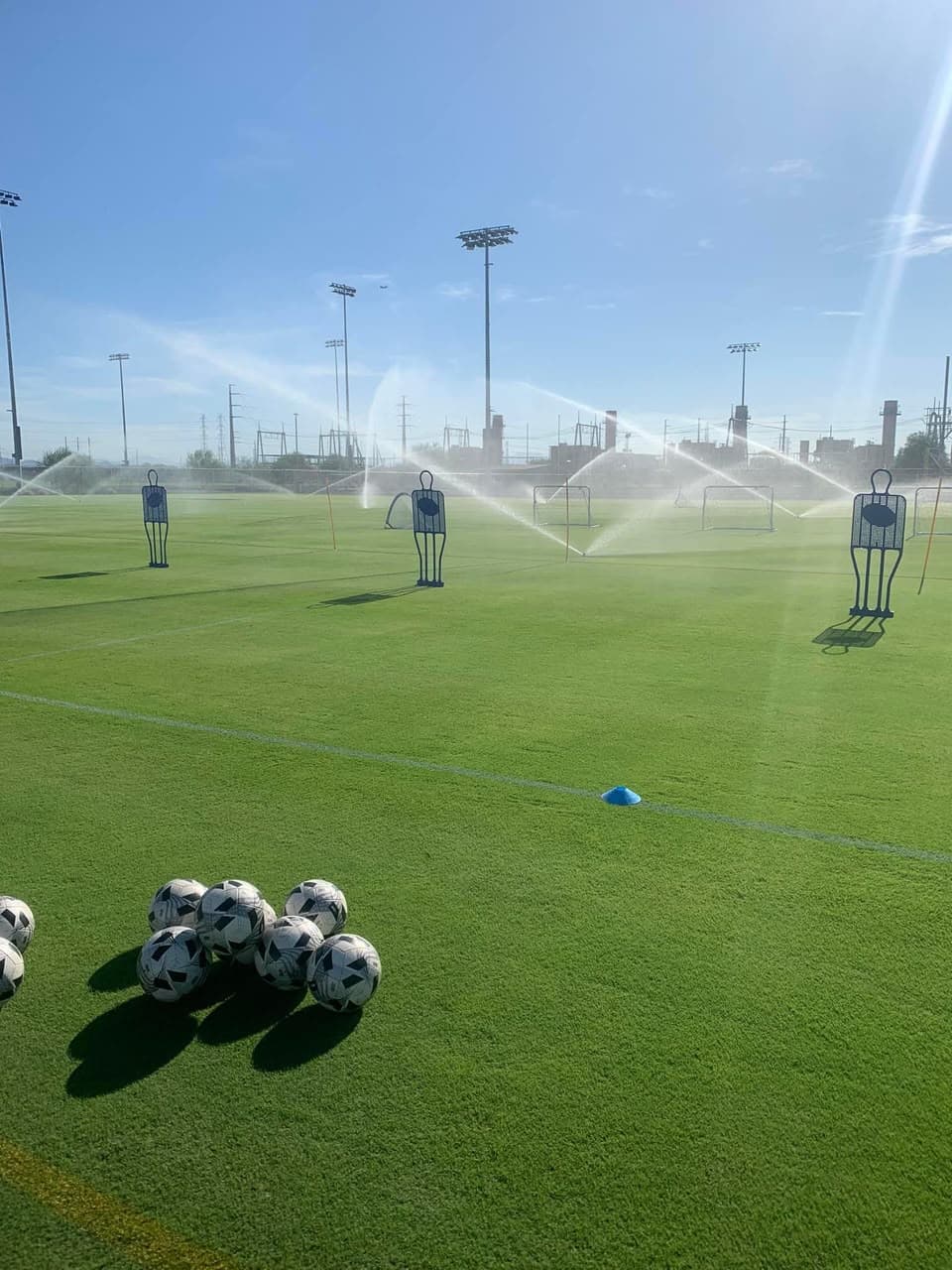 Sports training equipment on a well-kept pitch